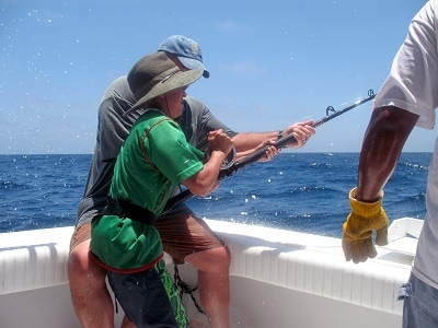 Child fishing on boat