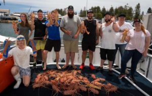 A group with freshly caught crayfish.